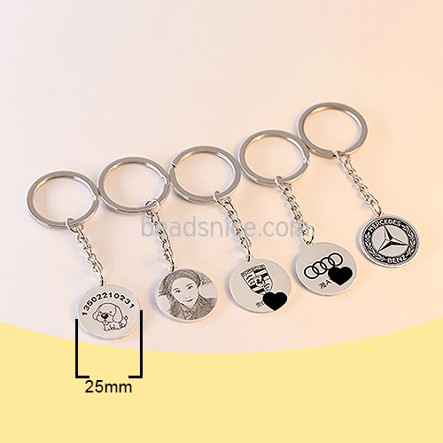 A single 1” sterling silver disc is stamped on a spiral and attached to a 25 mm 925 silver key ring.